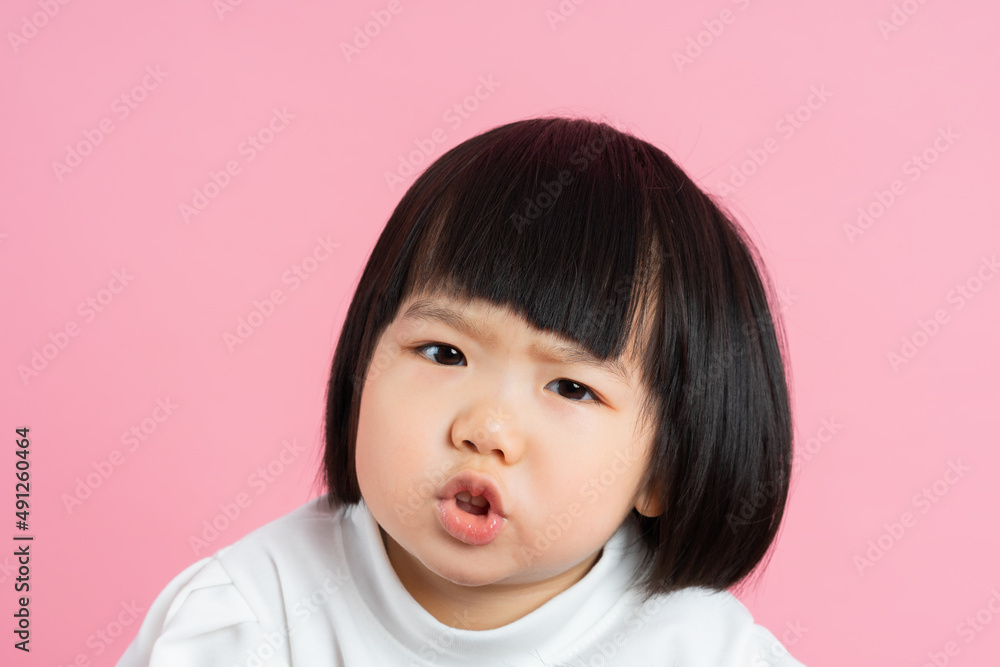 lovely baby girl portrait, isolated on pink background lovely baby girl portrait, isolated on pink background