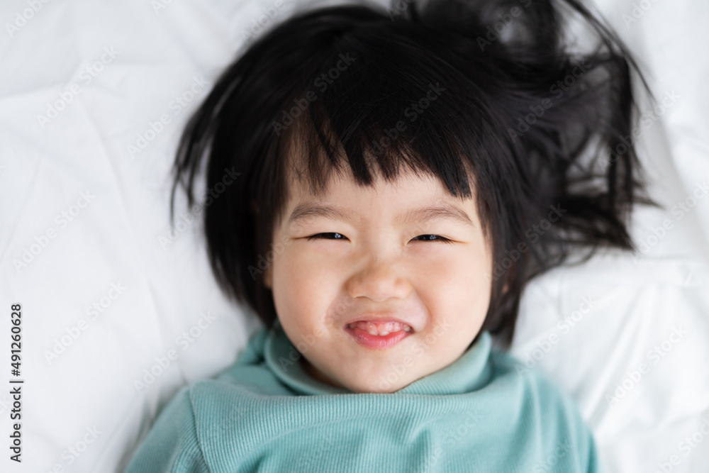 Portrait of a lovely baby girl in bed Portrait of a lovely baby girl in bed