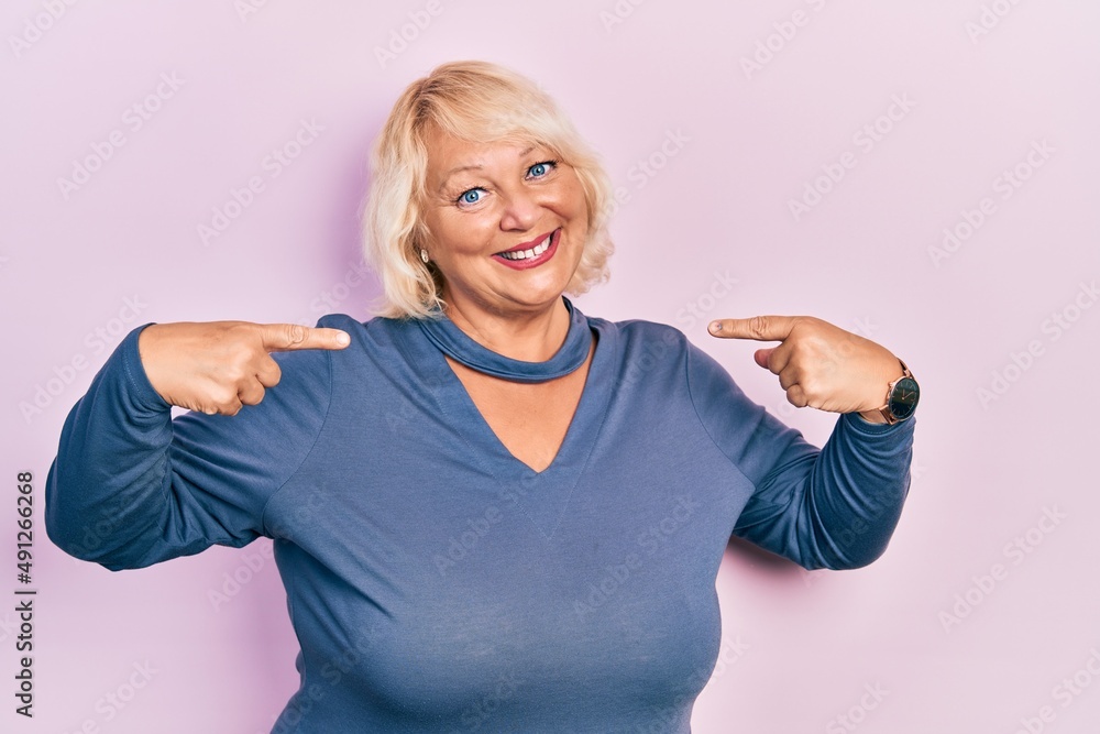 Middle age blonde woman wearing casual clothes looking confident with smile on face, pointing oneself with fingers proud and happy. Middle age blonde woman wearing casual clothes looking confident with smile on face, pointing oneself with fingers proud and happy.