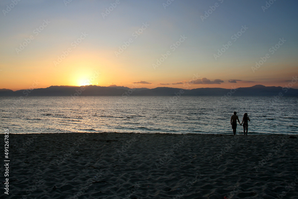 A couple of tourists at Moalboal White Beach in Cebu, Philippines.