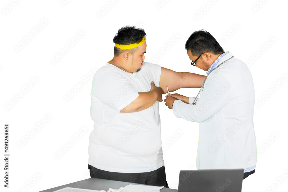 Doctor checks fat upper arm of patient on studio
