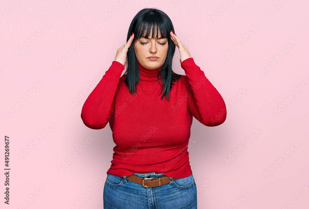Young hispanic woman wearing casual clothes with hand on head for pain in head because stress. suffering migraine. Young hispanic woman wearing casual clothes with hand on head for pain in head because stress. suffering migraine.