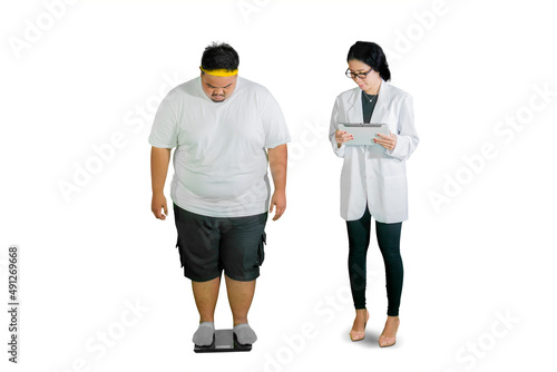 Doctor checks weight of her fat patient with scale