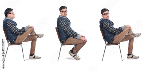side view of same men sitting on chair on white background