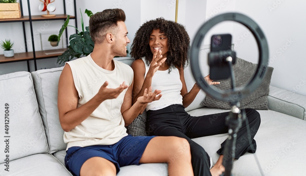 Man and woman couple using smartphone having video call at home Man and woman couple using smartphone having video call at home