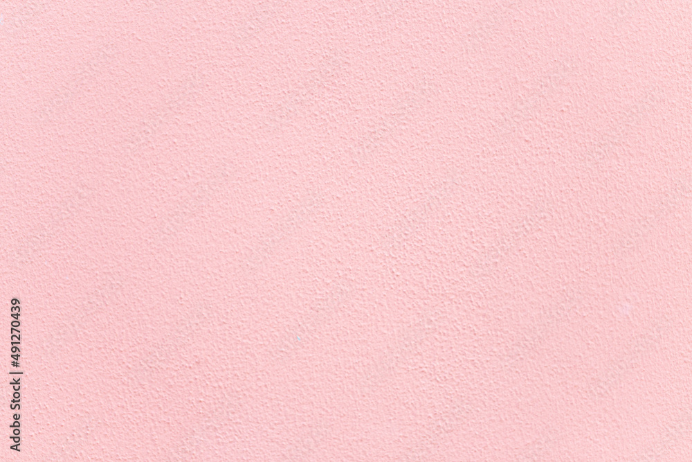 Fototapeta premium Pink plaster wall texture background