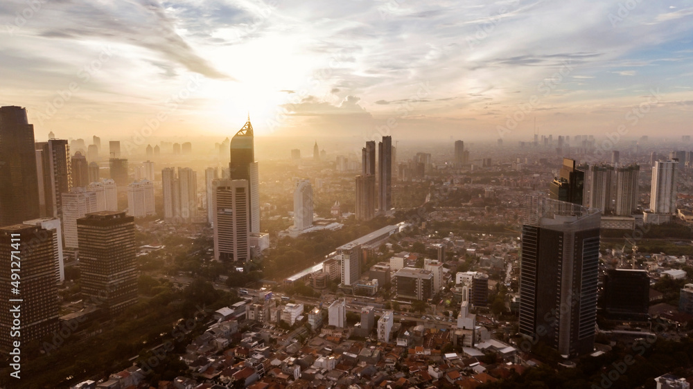 Beautiful misty Jakarta city with sunrise background