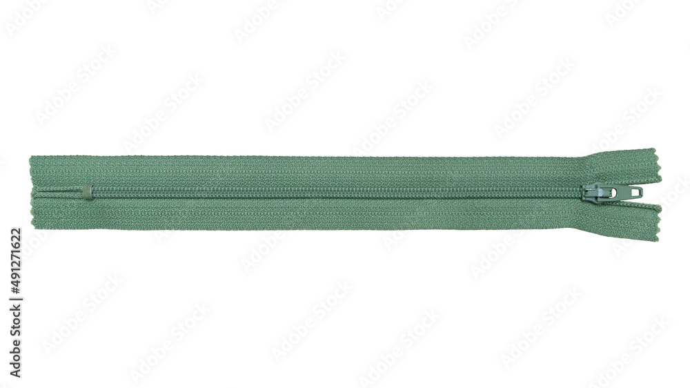 Green zipper for clothes on a white background. Isolated. Green zipper for clothes on a white background. Isolated.