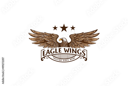Retro Vintage American Eagle Falcon Hawk Badge Emblem with Spread Wings and Ribbon Logo Design Vector