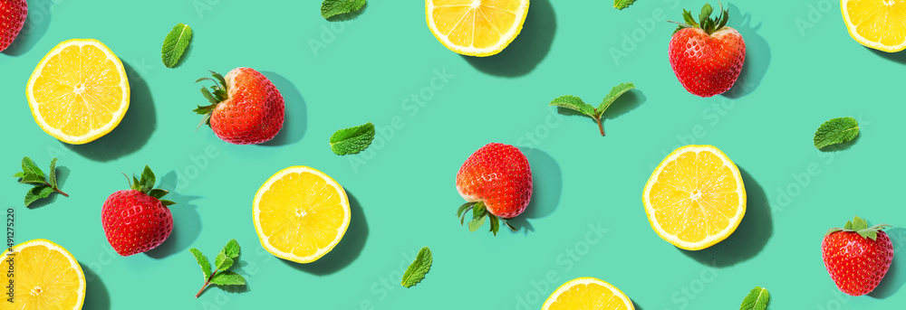 Fresh lemons and strawberries with mints overhead view - flat lay Fresh lemons and strawberries with mints overhead view - flat lay
