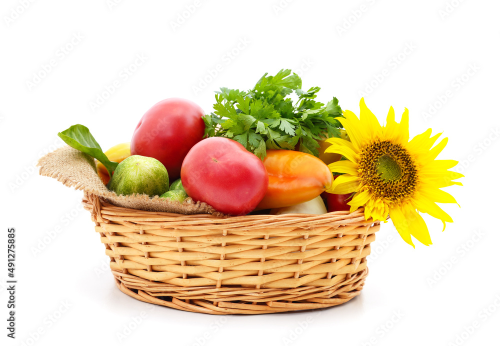 Different ripe vegetables in the cart with sunflower. Different ripe vegetables in the cart with sunflower.