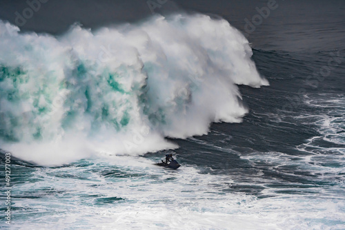 Jet ski escaping from a giant wave