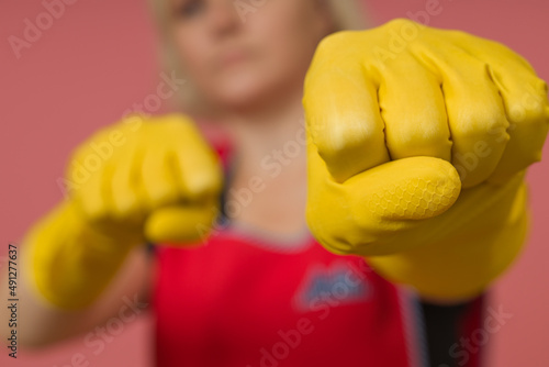 close-up woman cleaning lady in protective gloves boxing