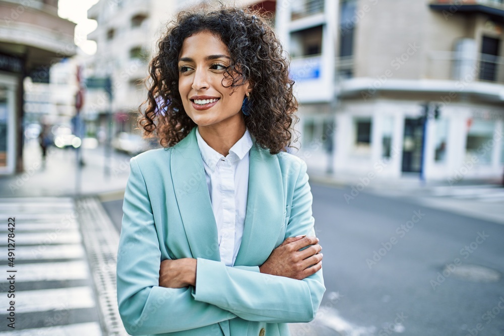 Young hispanic business woman wearing professional look smiling confident at the city Young hispanic business woman wearing professional look smiling confident at the city
