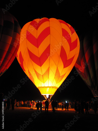 Hot air balloons preparing for pre-dawn flight