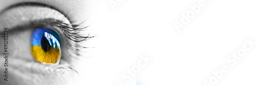 Girl yellow and blue eye on white panoramic background, Ukraine flag colors, Ukrainian people help and support web banner