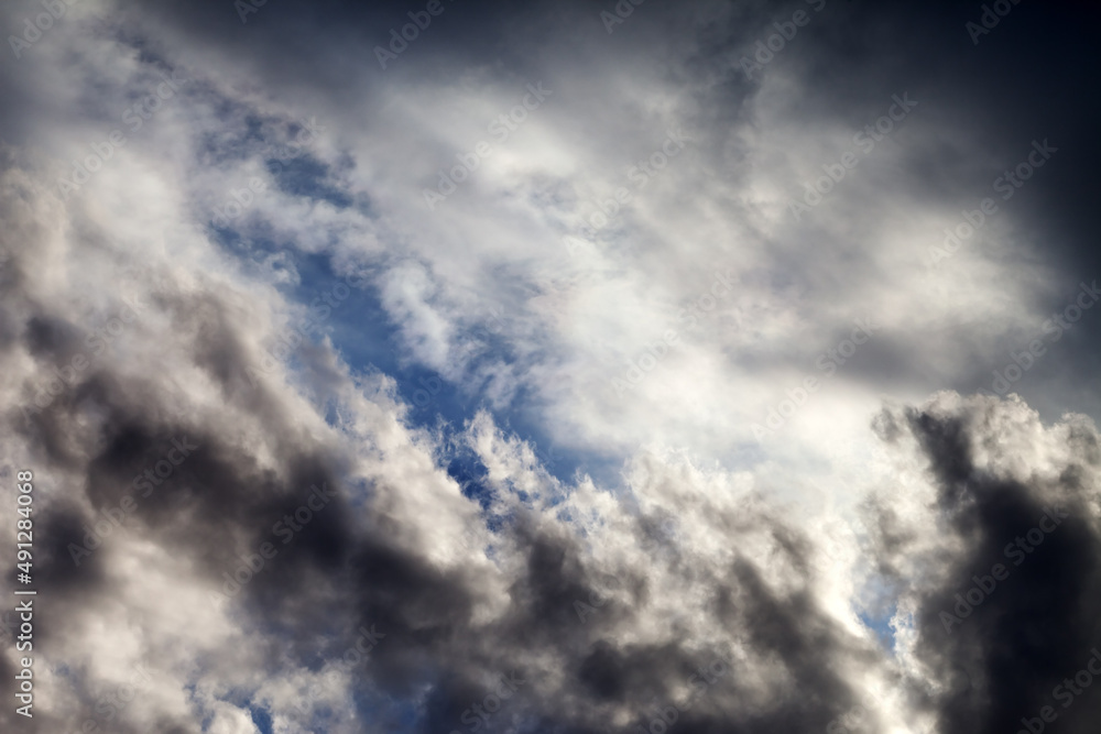 Sky with sunlight and dark clouds