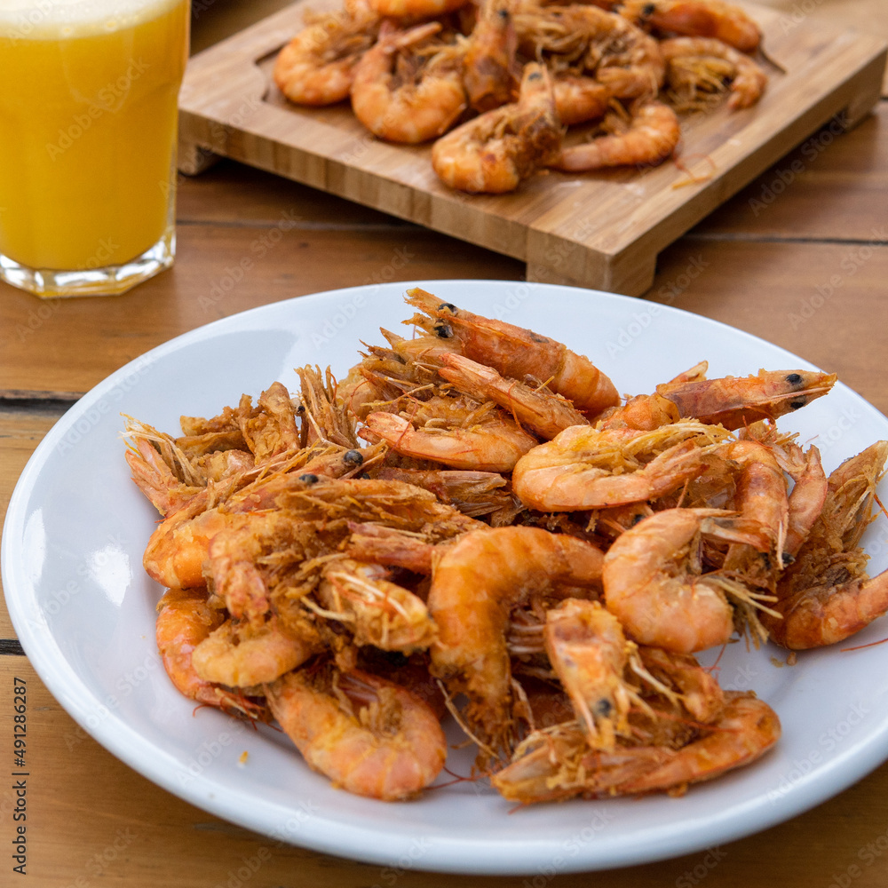 shrimp - tasty fried pink prawns served on a plate shrimp - tasty fried pink prawns served on a plate