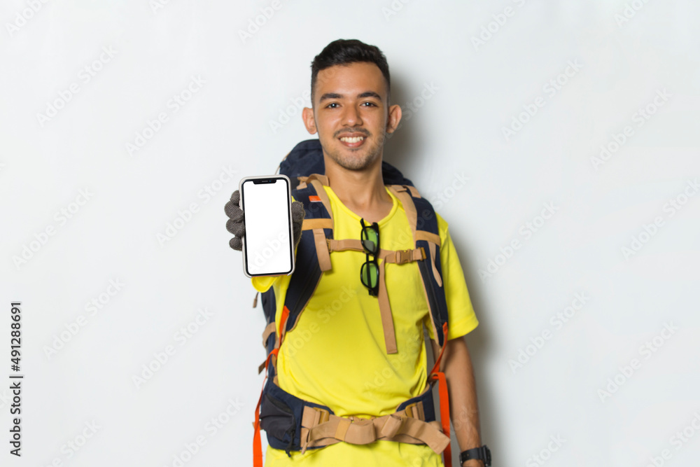 Young handsome hiker man hold mobile phone with blank empty screen isolated on white background
Young handsome hiker man hold mobile phone with blank empty screen isolated on white background