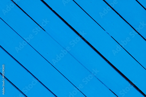 Wooden background painted with blue paint