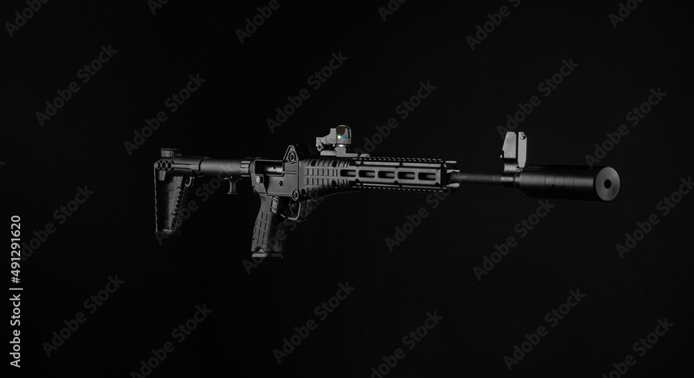 Small modern semi-automatic folding carabiner with collimator sight. A compact modern folding weapon for hunting, sports and self-defense.Dark back.