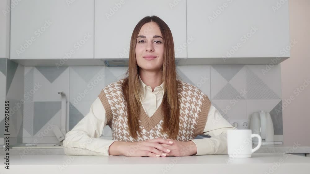woman in shirt and vest looking at camera, holding conversation with business client online. Pleasant smart female job applicant answering on questions at video call interview meeting. woman in shirt and vest looking at camera, holding conversation with business client online. Pleasant smart female job applicant answering on questions at video call interview meeting.