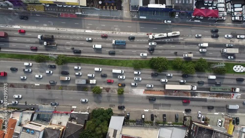 Traffic of cars and trucks in big avenue of metropolis São Paulo, South America, Brazil - drone top view photo