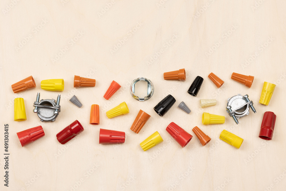 Horizontal flat layout of assorted color wire nuts and connectors on