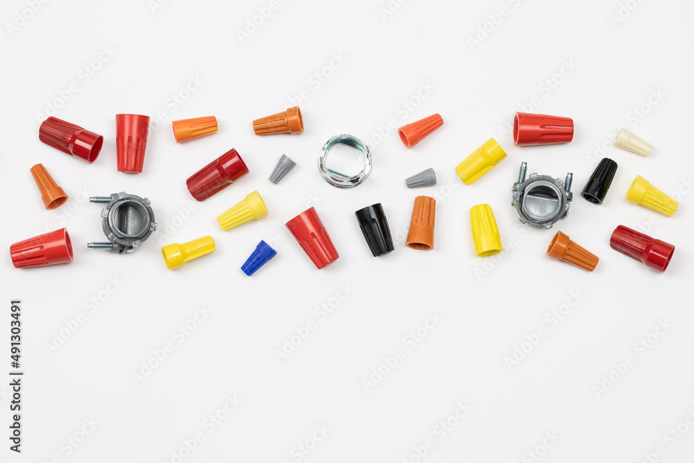 Horizontal flat layout of assorted color wire nuts and connectors on