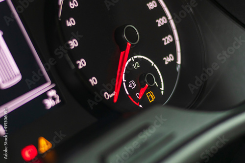 Fuel discharge warning light on the dashboard of the car. The low fuel level is displayed on the dashboard of the speedometer.