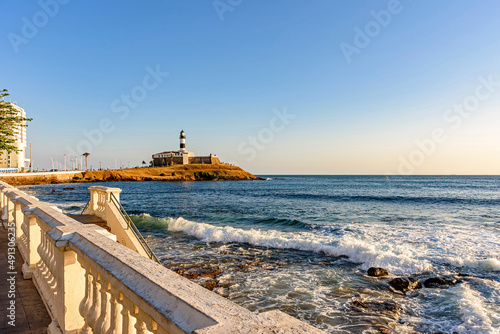 Barra Lighthouse, one of the main tourist spots in Salvador in Bahia surrounded by the sea and city during the late summer afternoon