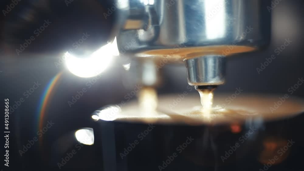 close-up of coffee preparation in a coffee machine, macro video of coffee drops pouring into a cup. Fragrant drink in the morning. close-up of coffee preparation in a coffee machine, macro video of coffee drops pouring into a cup. Fragrant drink in the morning.