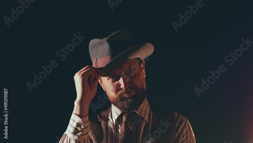 Smartly dressed man tipping his hat photo