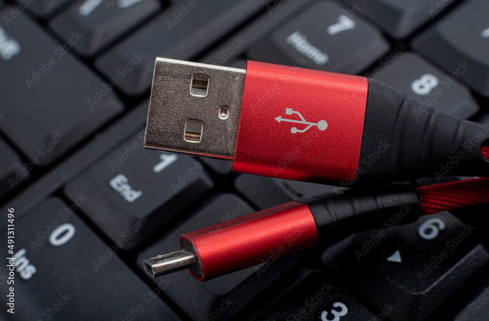 The usb cable for charging peripherals is on the keyboard in black The usb cable for charging peripherals is on the keyboard in black