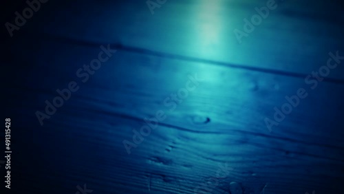 Hand picking up a glass of drink from the bar