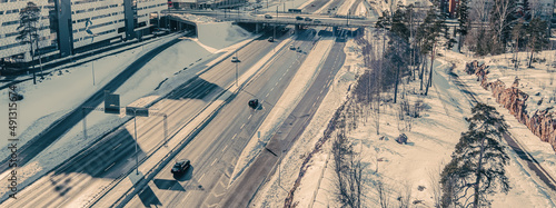 Aerial view of the highway and intersection in the city on a winter day