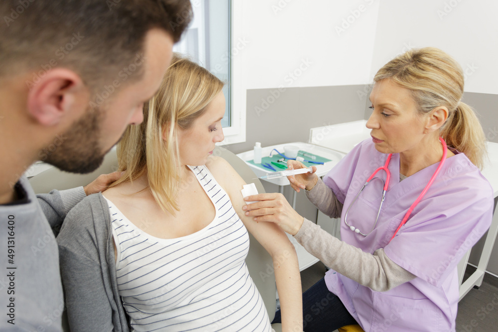 doctor making insulin or flu vaccination shot by syringe doctor making insulin or flu vaccination shot by syringe