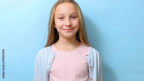Teenage girl takes omega 3 capsules on a colored background close-up