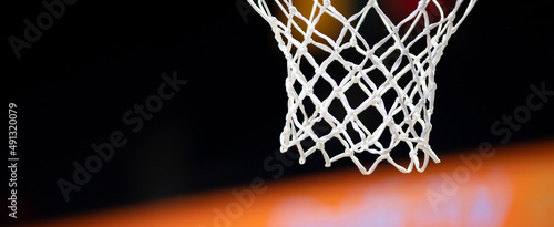 Basketball hoops against dark background. Banner art concept. Horizontal sport theme poster, greeting cards. © Augustas Cetkauskas