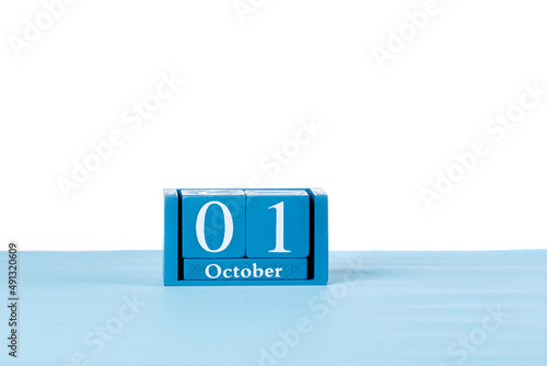 Wooden calendar October 01 on a white background