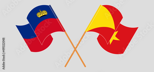 Crossed and waving flags of Liechtenstein and Tigray