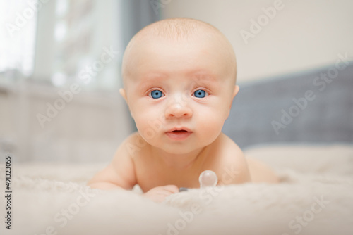 Funny and beautiful baby on the bed. children's health. 