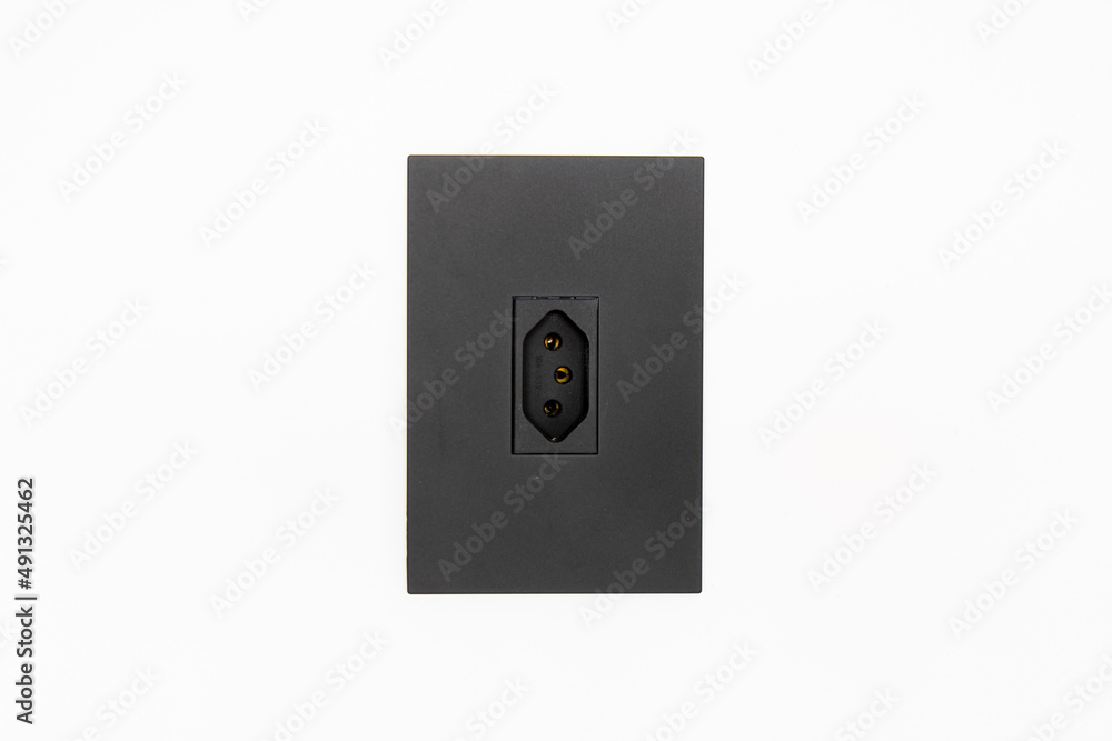 White wall with a centered black electric plug. Plug type J (brazil and South Africa) White wall with a centered black electric plug. Plug type J (brazil and South Africa)