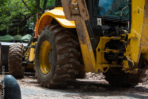 working bulldozer working on city streets