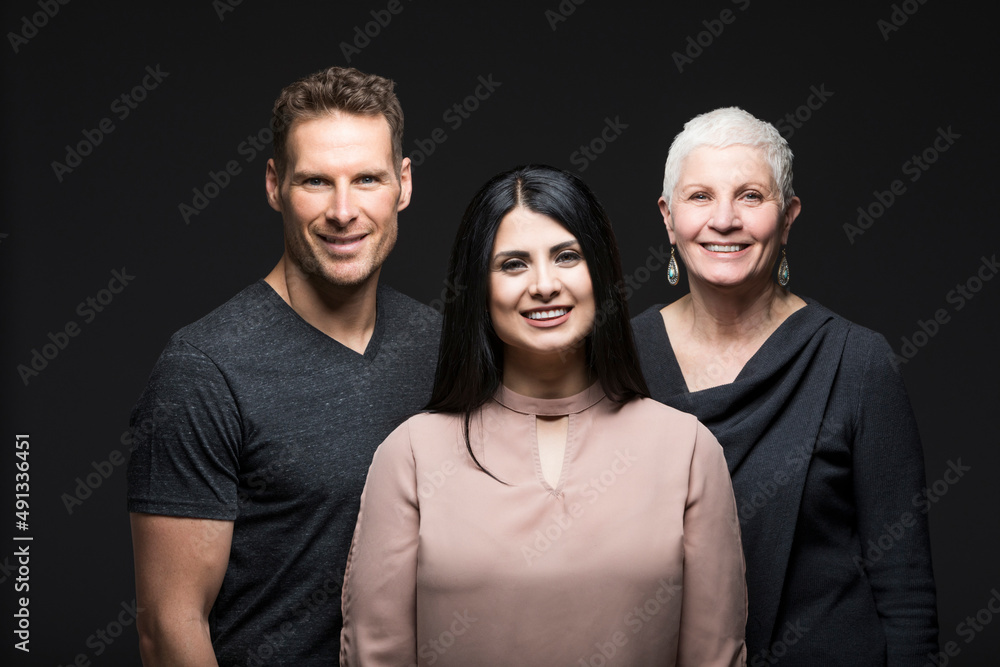 Studio portrait of three smiling people Studio portrait of three smiling people