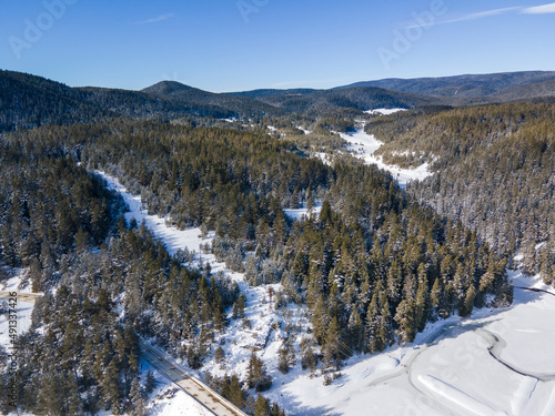 Aerial winter view of Beglika Reservoir covered with ice, Bulgaria photo