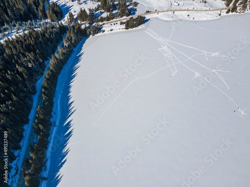 Aerial winter view of Beglika Reservoir covered with ice, Bulgaria photo