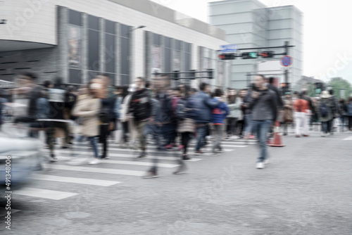 City crosswalk lines and blurred crowd