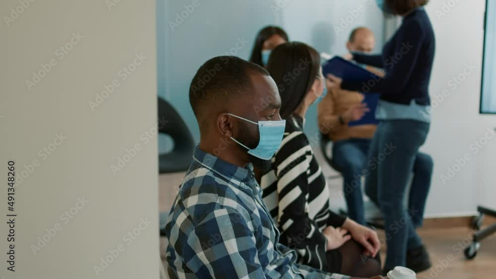 African american recruit with cv file waiting to attend job interview, preparing for meeting about career opportunity. Male candidate feeling nervous about employment during covid 19 pandemic. African american recruit with cv file waiting to attend job interview, preparing for meeting about career opportunity. Male candidate feeling nervous about employment during covid 19 pandemic.