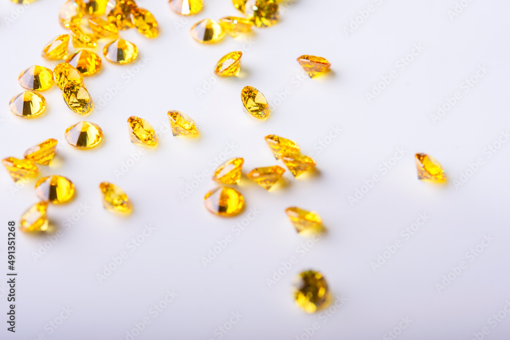 Polished diamonds of different cuts and sizes on light background .Gemstone Beauty